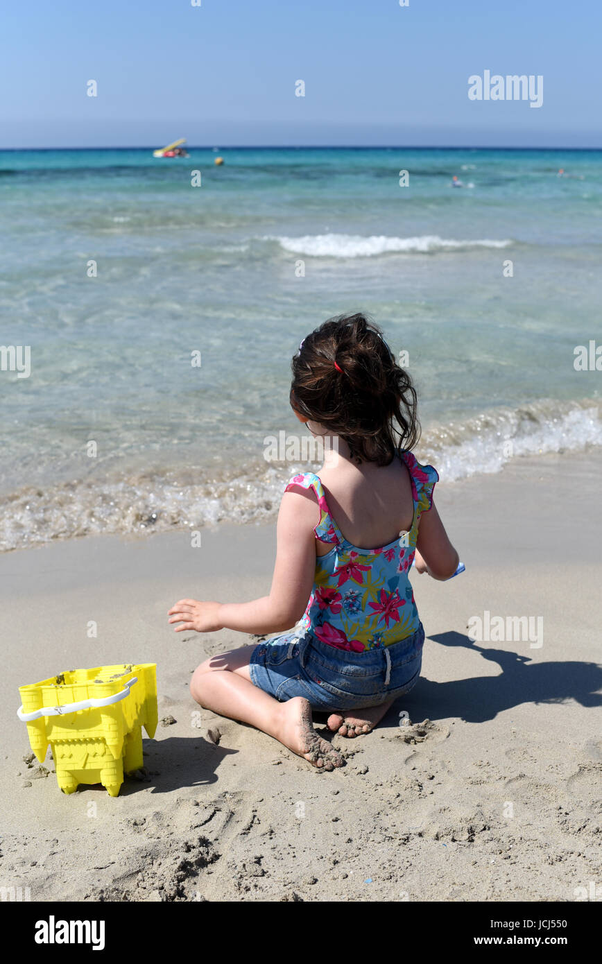 Playing on a sandy beach, Menorca, Spain Stock Photo