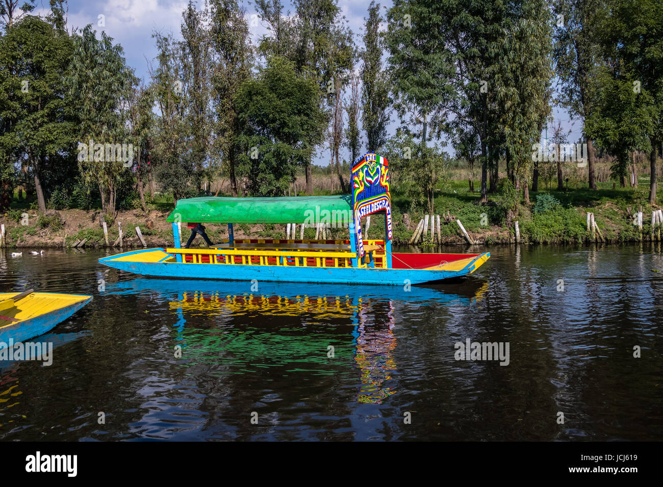 Colorful boat (also known as trajinera) at Xochimilco's Floating Gardens - Mexico City, Mexico Stock Photo