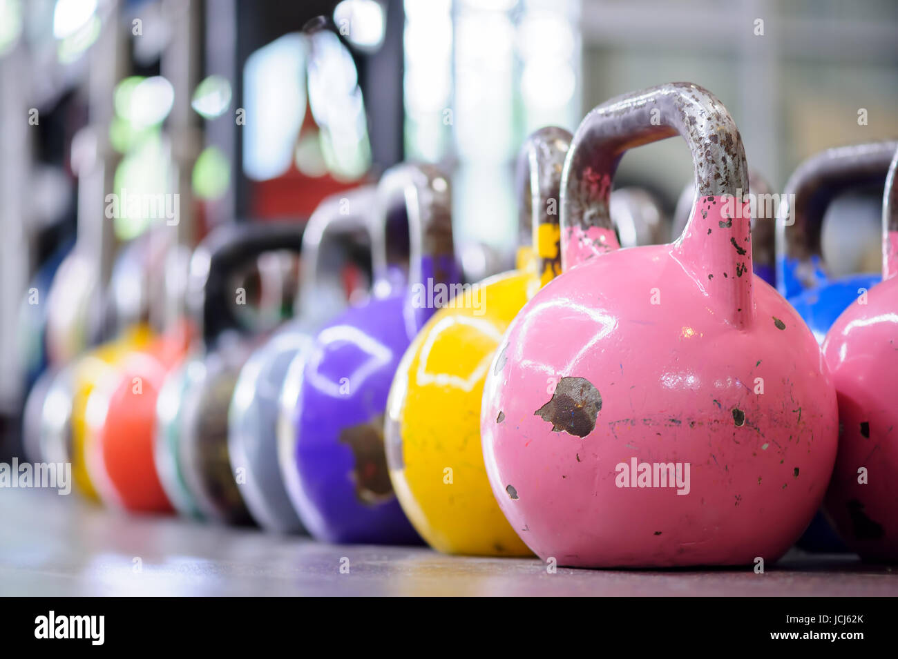colorful kettlebells in a row in a gym Stock Photo Alamy