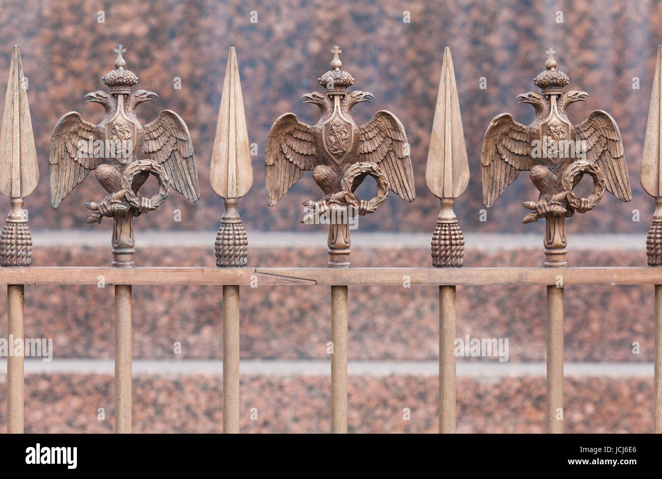 Bronze State two-headed eagle after restoration on the fence of the Alexander Column on The Palace Square Stock Photo