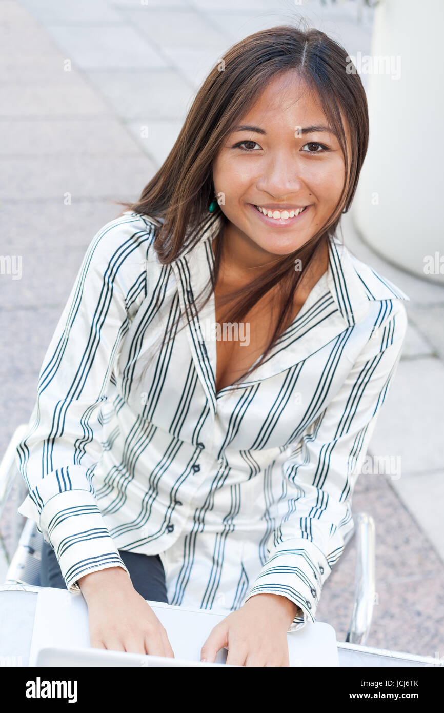 Portrait of a young asian woman using a laptop Stock Photo - Alamy