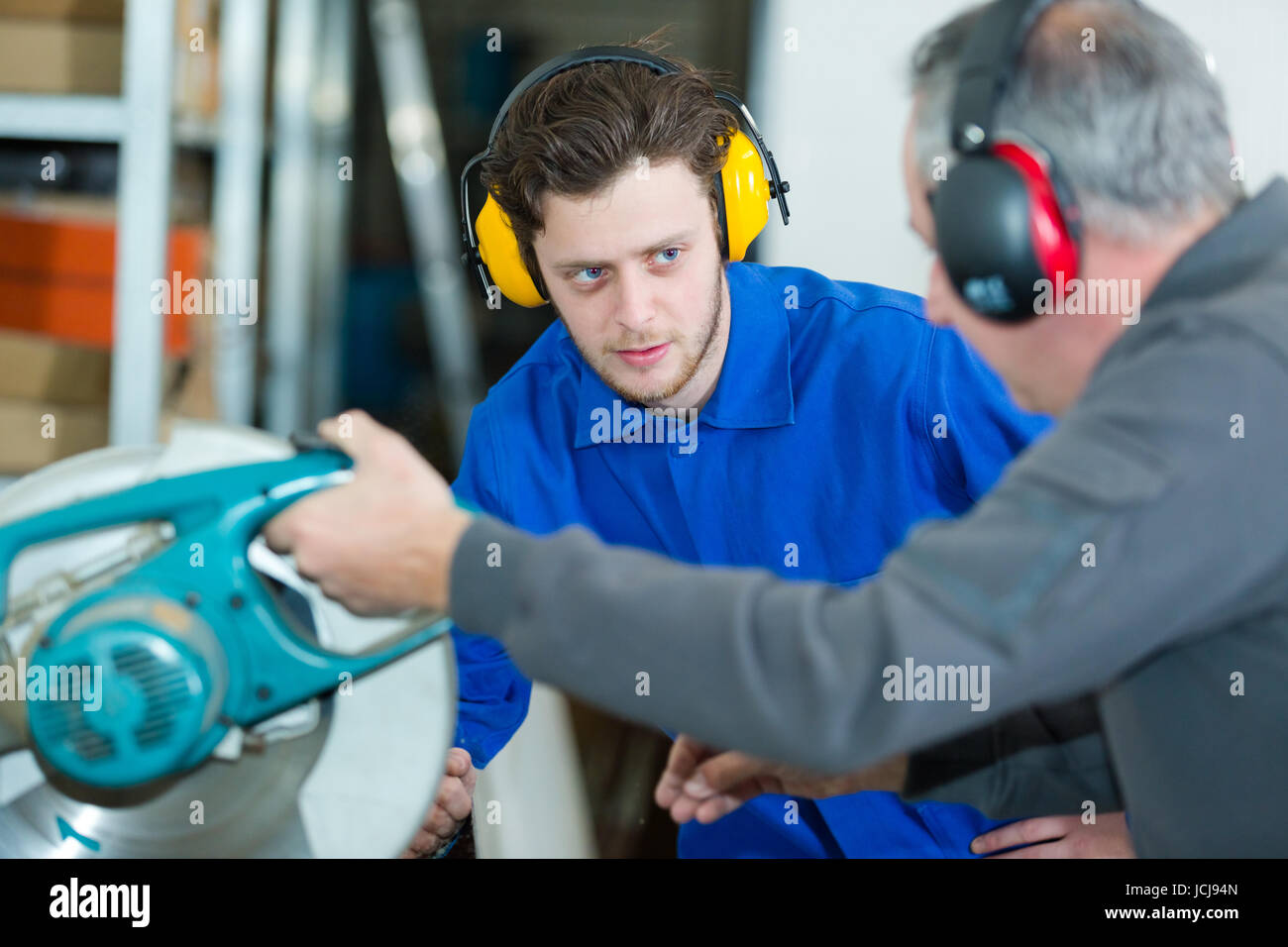 young man cutting in a factory Stock Photo