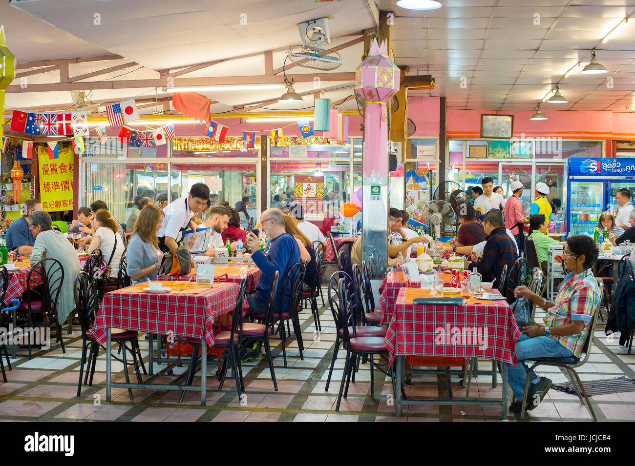 CHIANG MAI, THAILAND - JAN 11, 2017: People at a street restaurant at night market in Chiang Mai. Chiang Mai is a culture capital of Thailand Stock Photo