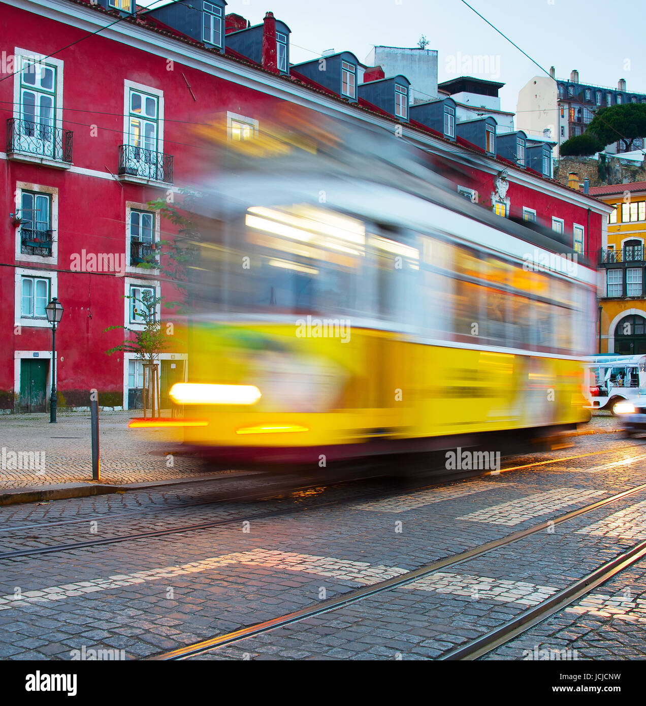 Famous tram 28 on Alfama street, motion blur. Lisbon, Portugal Stock Photo