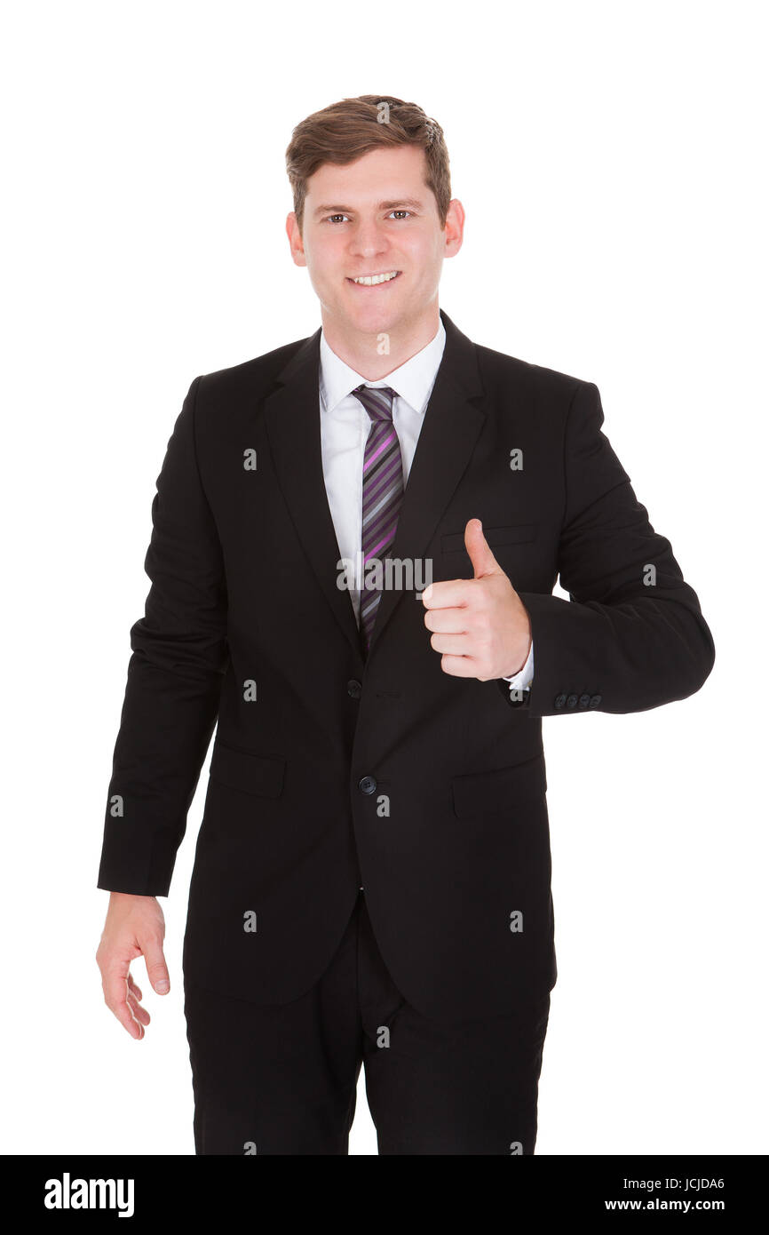 Portrait of businessman showing thumb up sign isolated on white ...