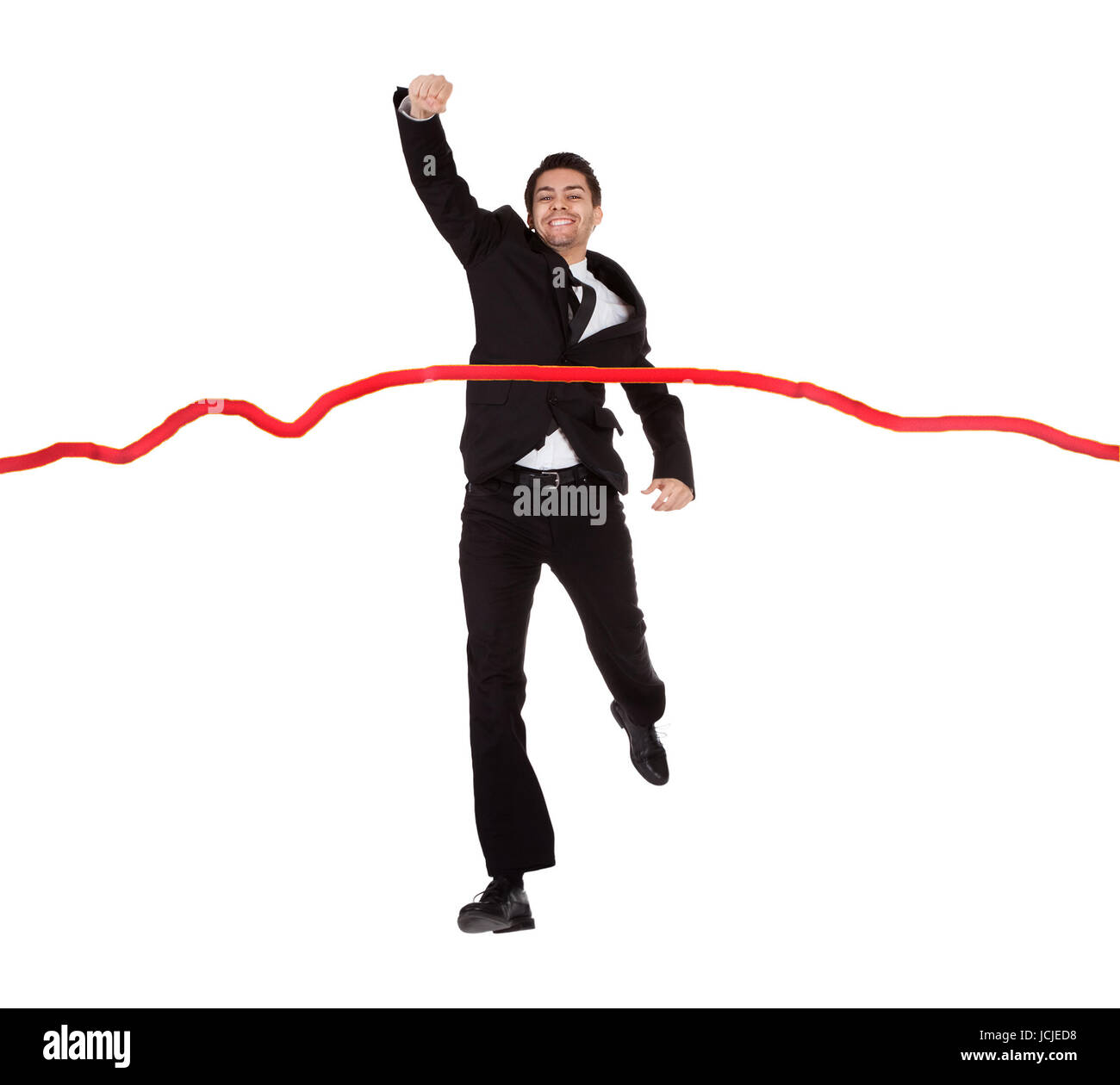 Businessman running through finishing line. Isolated on white Stock