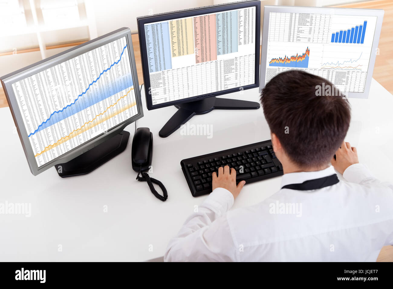 Broker Computer Screen Over the shoulder view of the computer screens of a stock broker ...