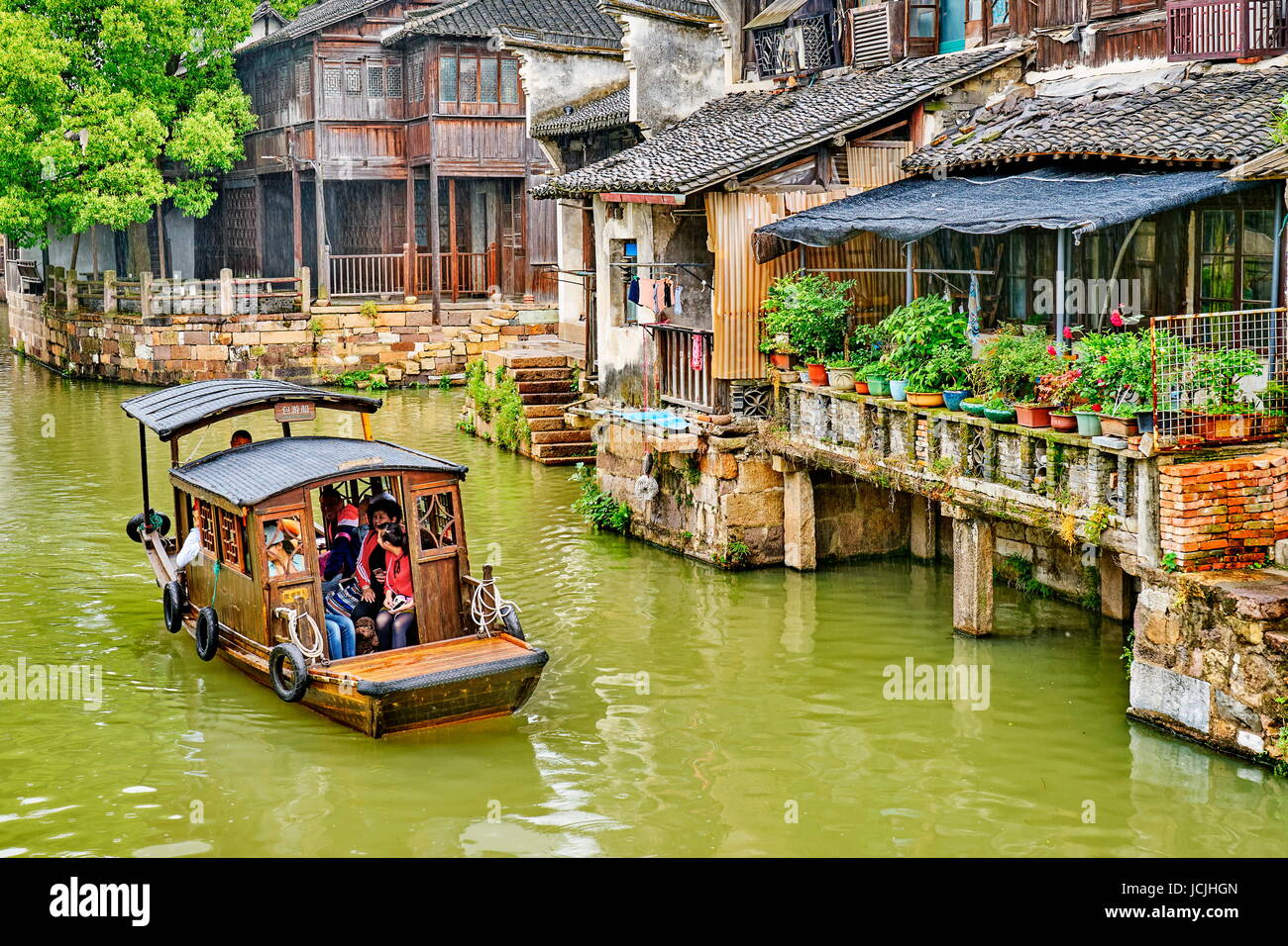 Traditional wooden chinese boat on the Wuzhen canal, Zhejiang province, China Stock Photo