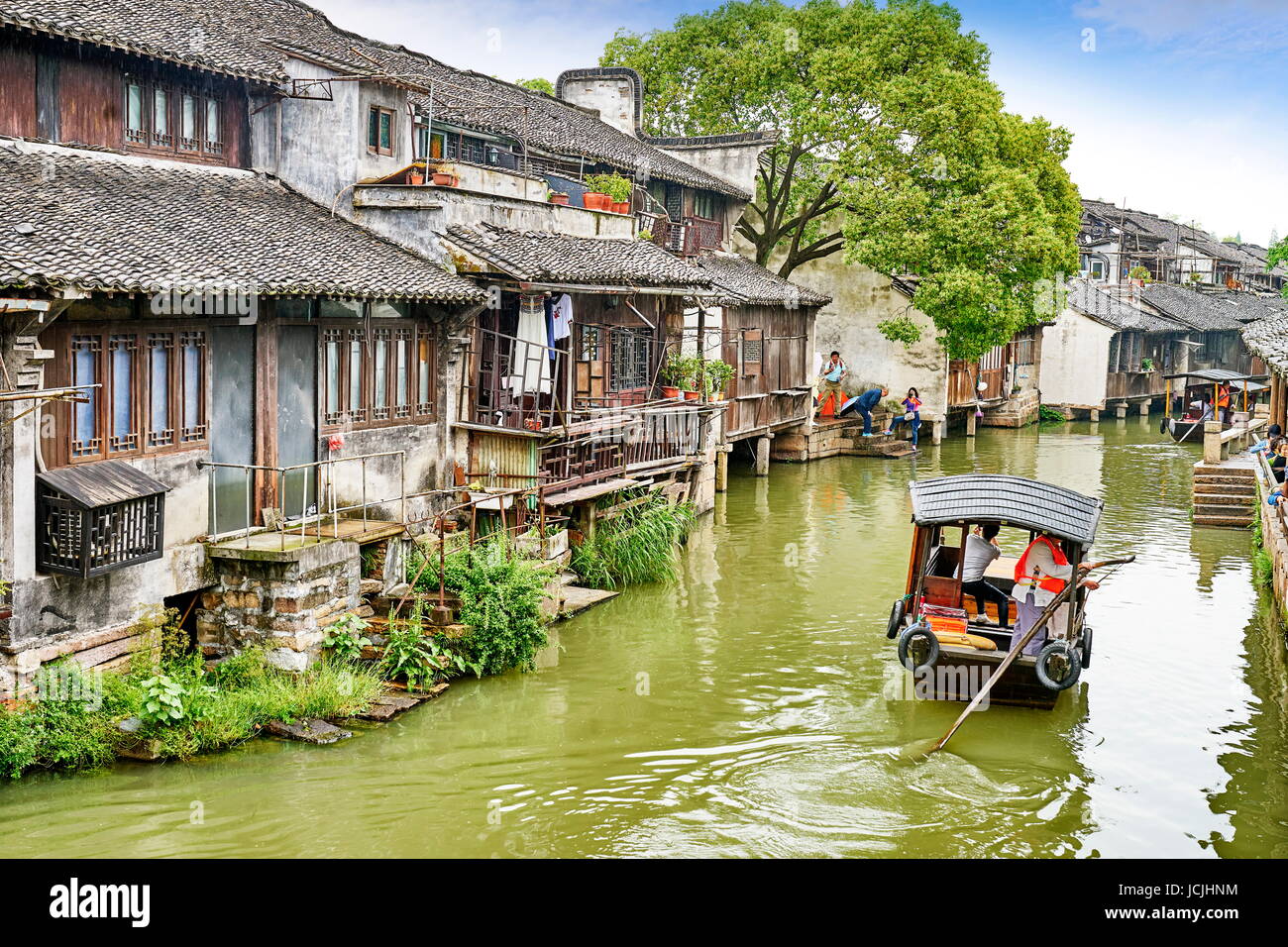 Traditional wooden chinese boat on the Wuzhen canal, Zhejiang province, China, Asia Stock Photo