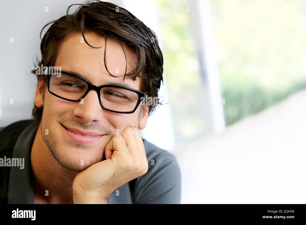 Portrait of handsome young man with glasses Stock Photo - Alamy