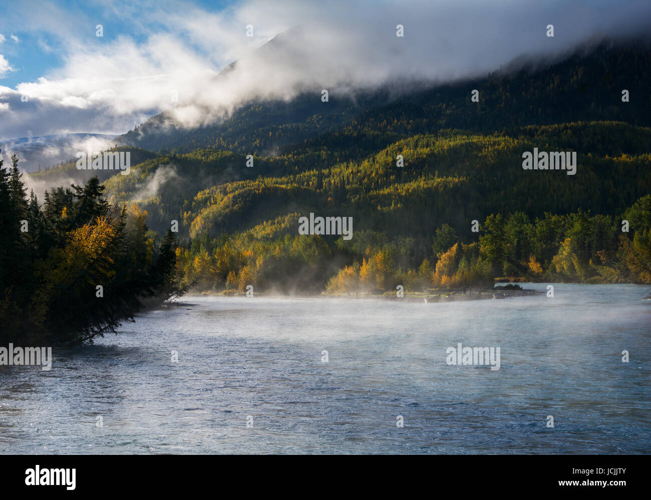 Warm water causes a mist to rise on the Russian River in south central Alaska. Stock Photo