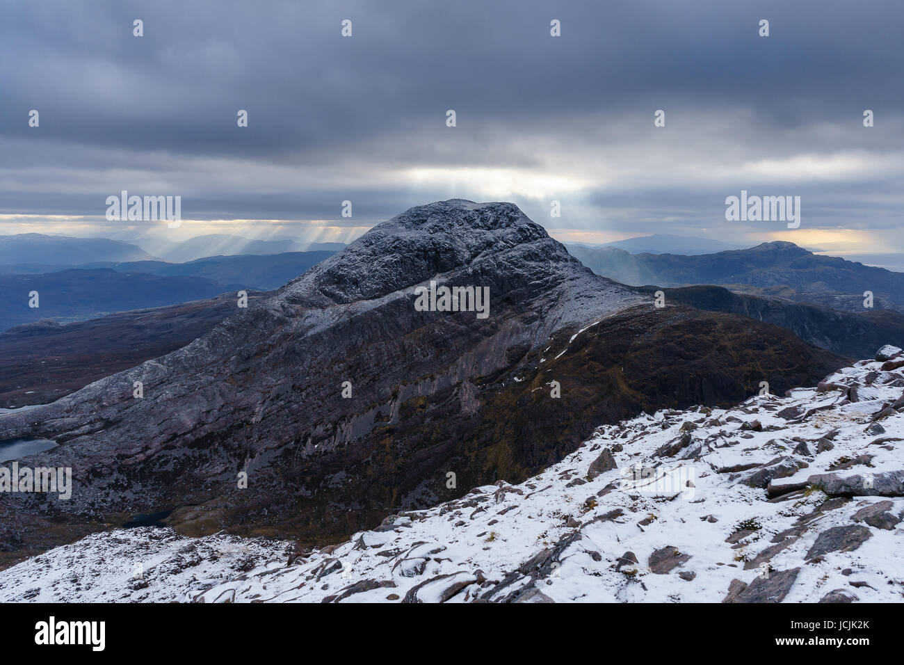 Shafts of light over An Ruadh-Stac on Wintry Day Stock Photo