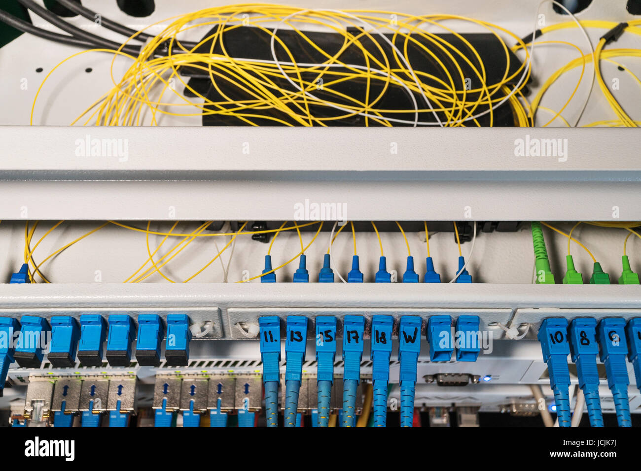 Rack with routers with open top cover and wires inside Stock Photo - Alamy