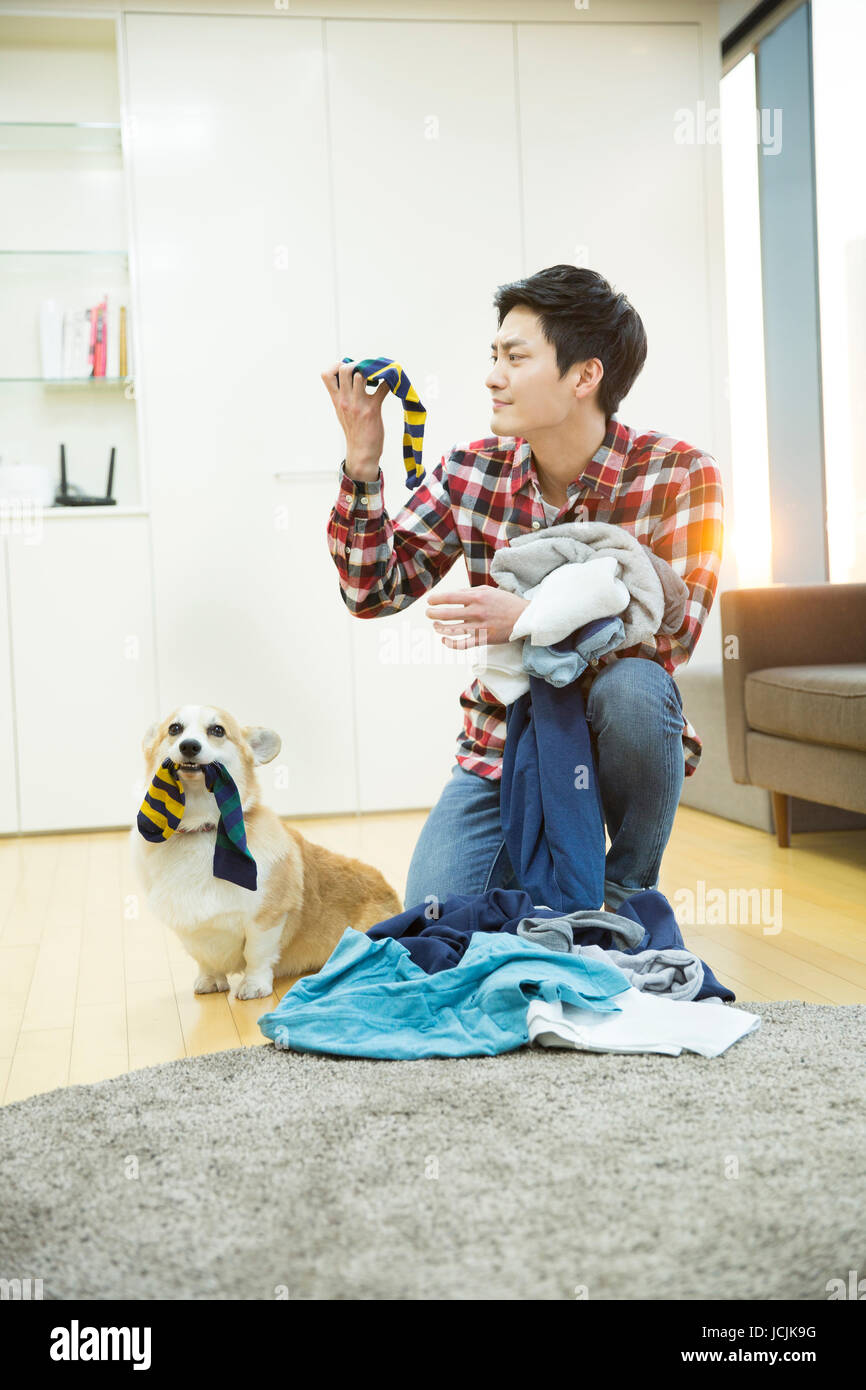 Lifestyle of young bachelor and his pet dog Stock Photo Alamy
