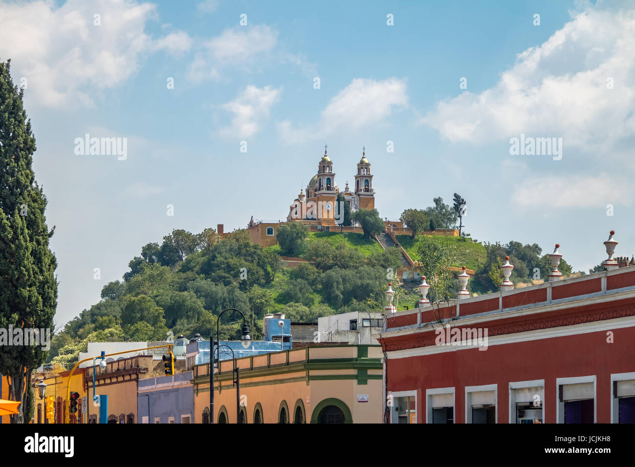 Street of Cholula and Church of Our Lady of Remedies at the top of Cholula pyramid - Cholula, Puebla, Mexico Stock Photo