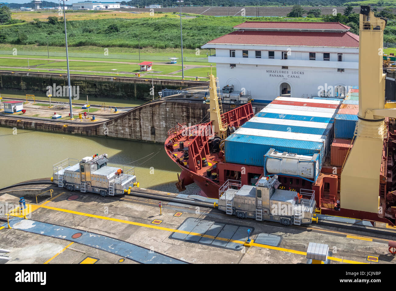 Cargo Ship crossing Panama Canal at Miraflores Locks - Panama City, Panama Stock Photo