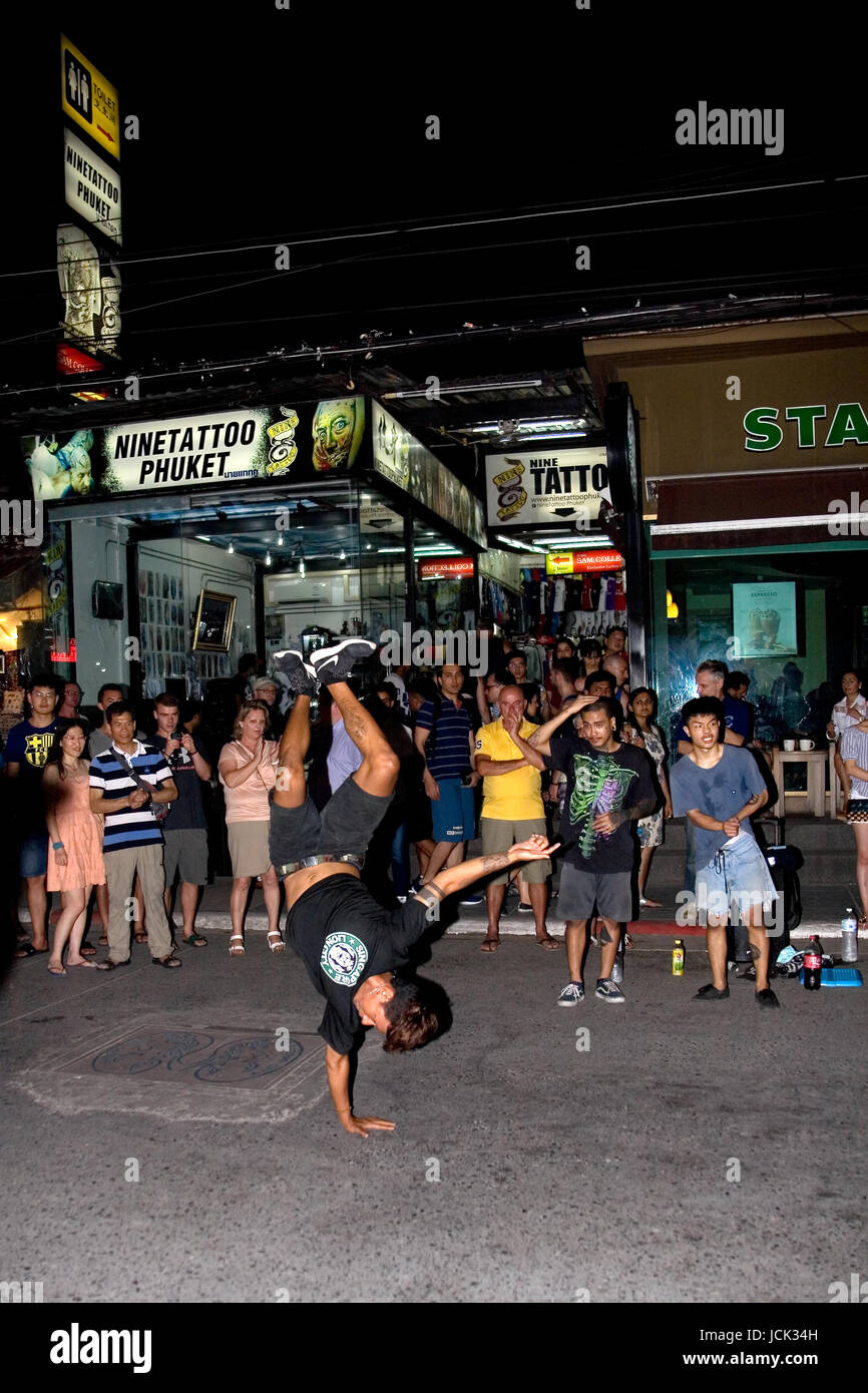 Phuket, Thailand, January 27, 2017: A young man dancing in front of the audience on Bangla Road. Stock Photo