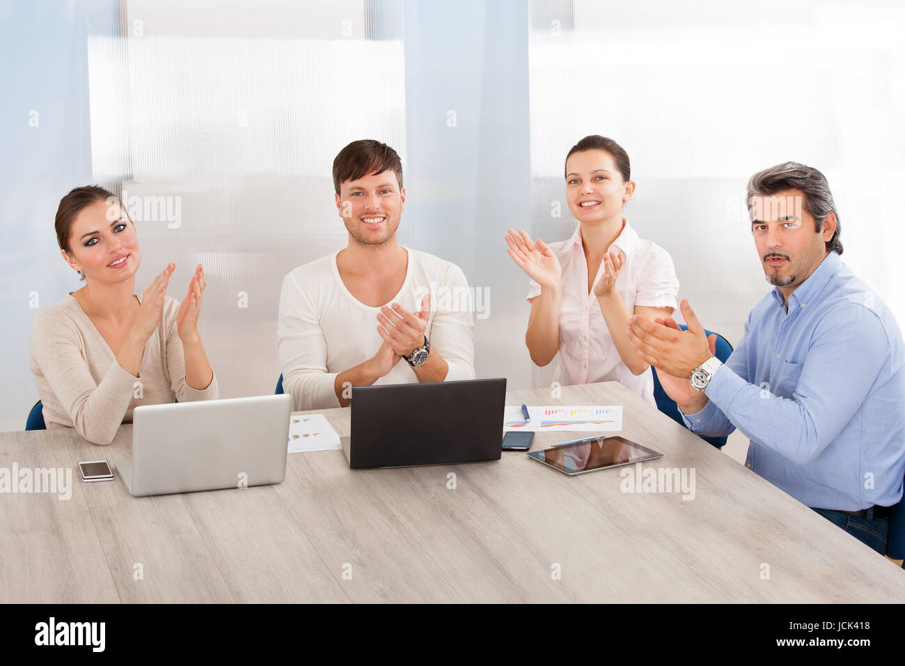 Smiling mature woman greets hi-res stock photography and images - Alamy