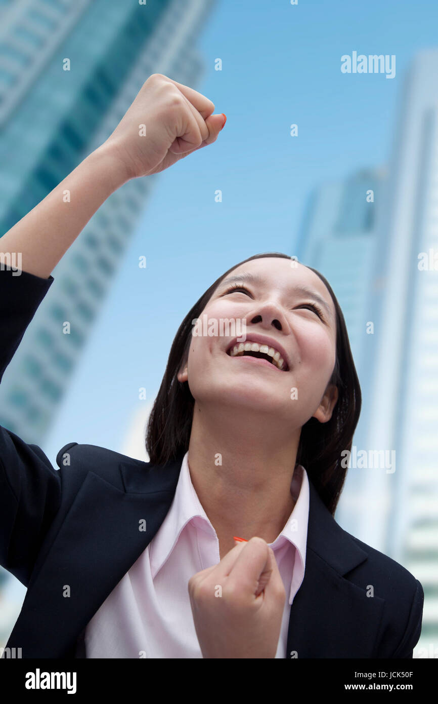 One woman arm up career success hi-res stock photography and images - Alamy