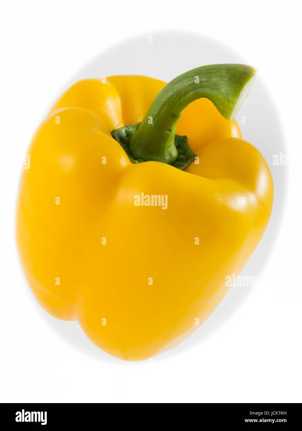 One pepper yellow on white background Stock Photo - Alamy