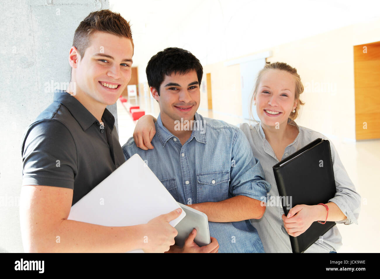 Portrait of students in school corridor Stock Photo - Alamy