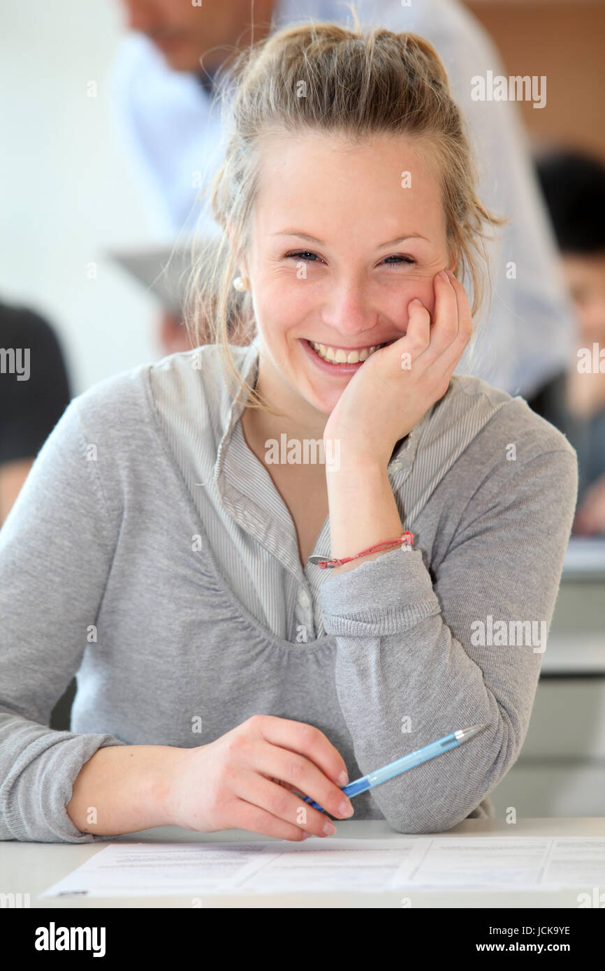 Portrait of smiling student girl in class Stock Photo - Alamy