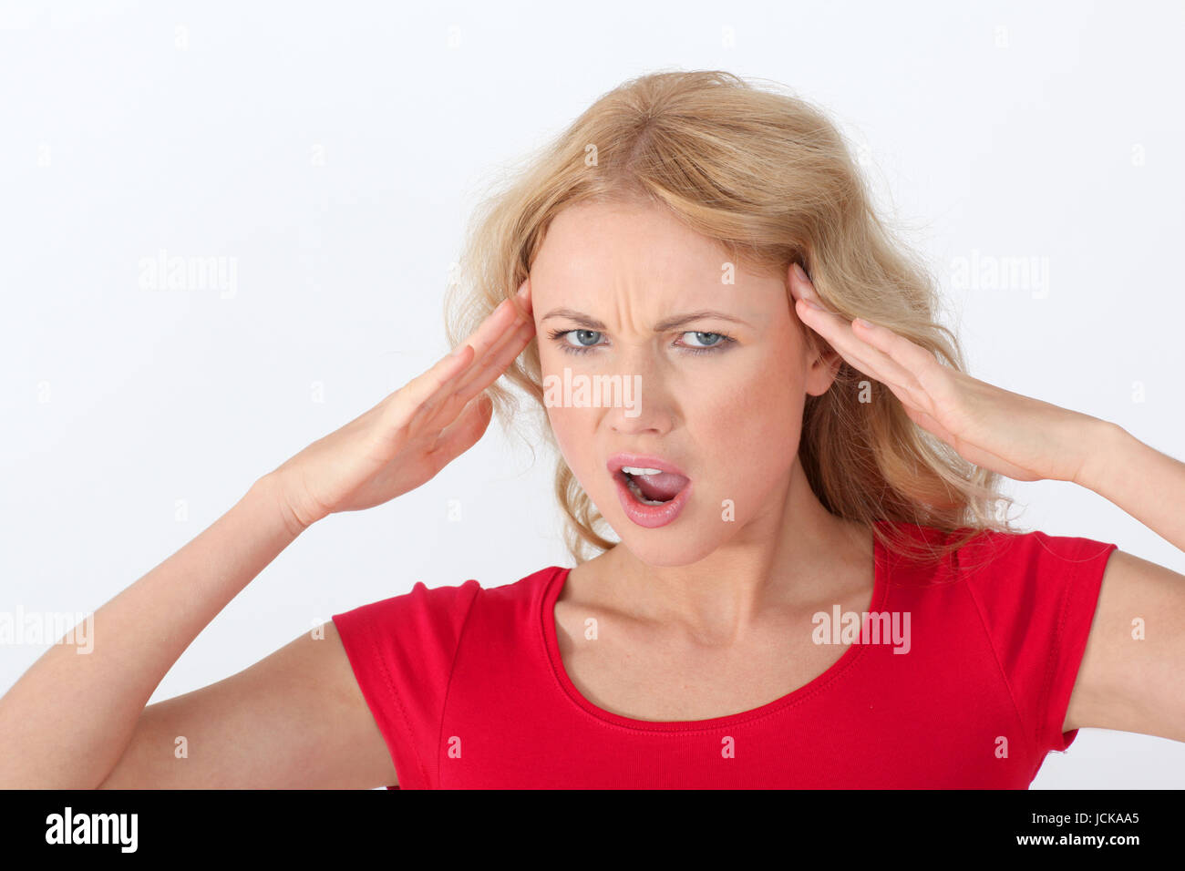 Portrait of blond woman with horrified look Stock Photo - Alamy