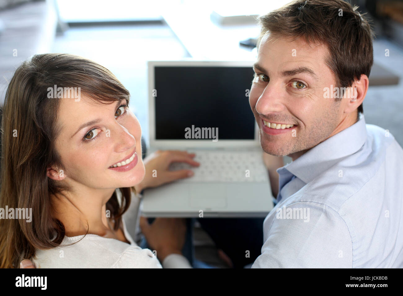 Upper view of smiling couple using laptop computer Stock Photo - Alamy