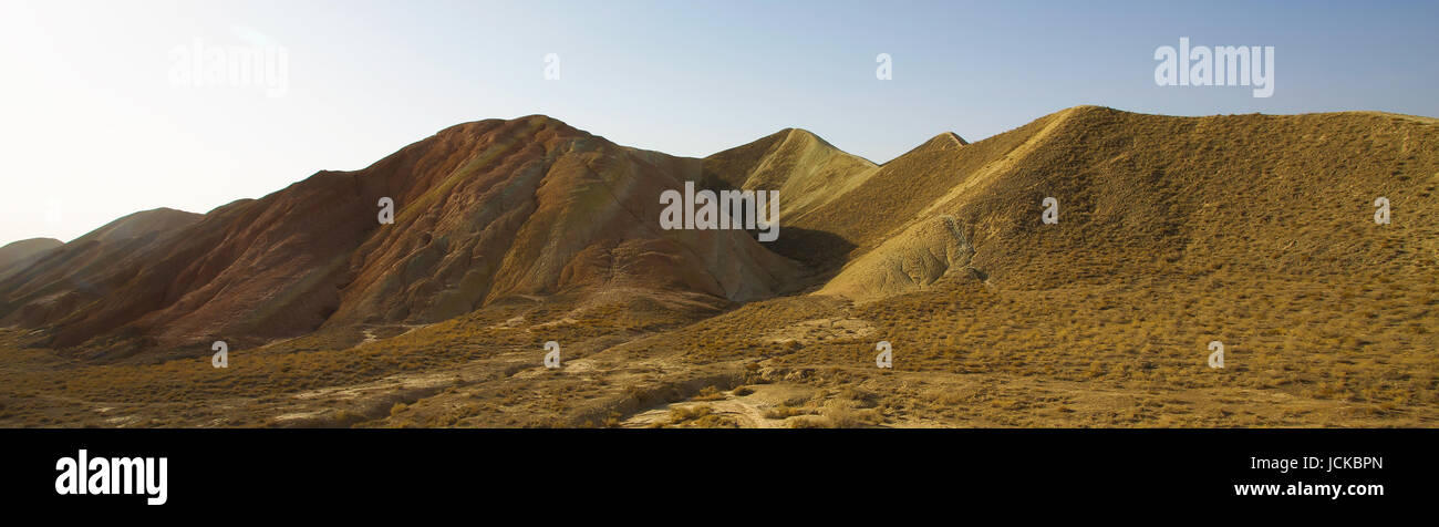 Yellow sandstone hills in desert with clear blue sky , Scenery in Tibet . Stock Photo