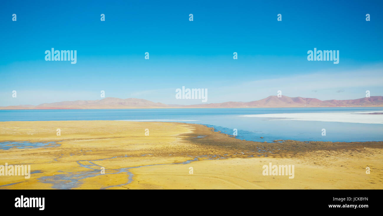 Beautiful lake and yellow fields scenery in Tibet . Stock Photo