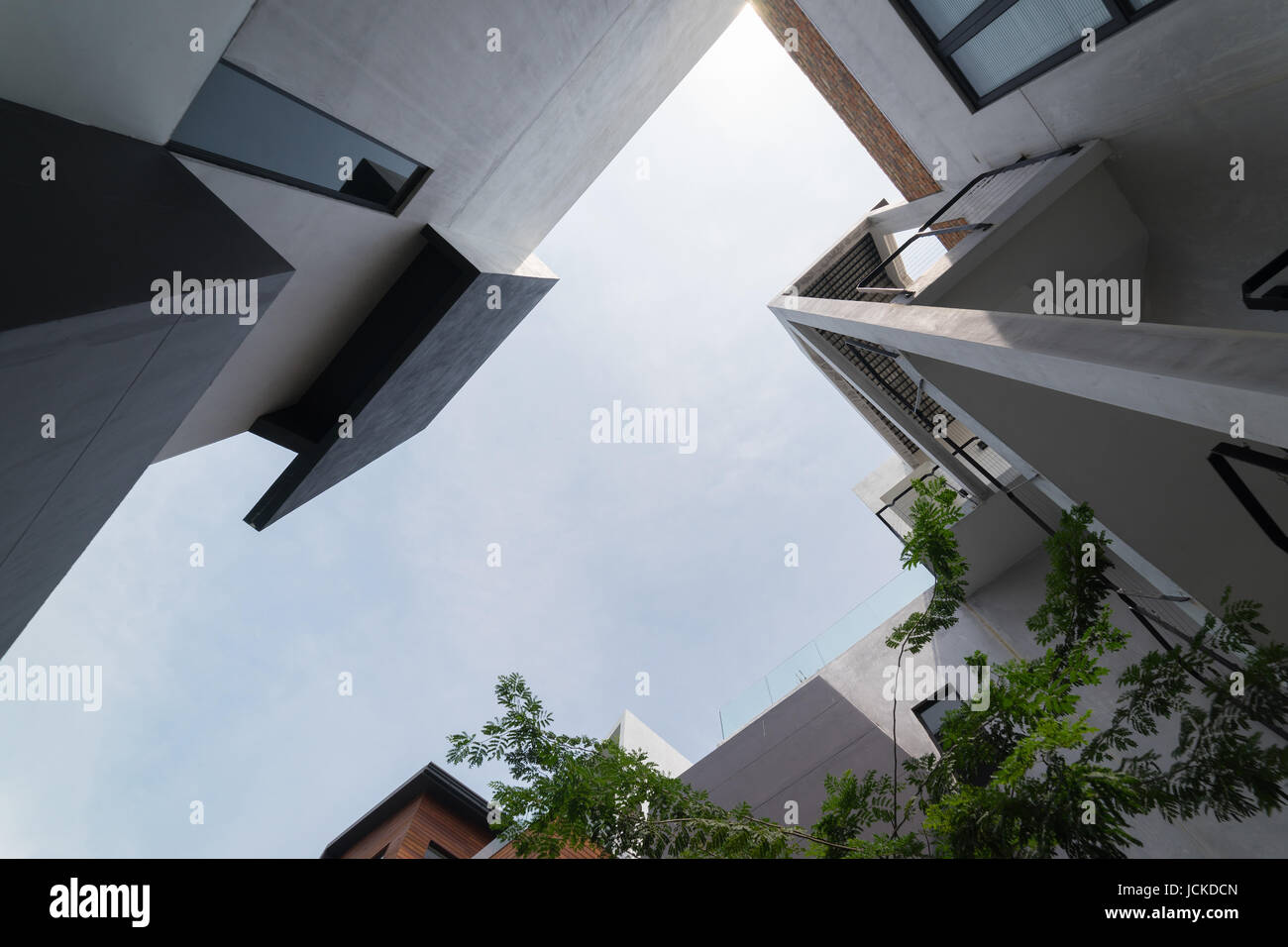 Urban Geometry, looking up to cement building. Modern and abstract architecture design . Stock Photo