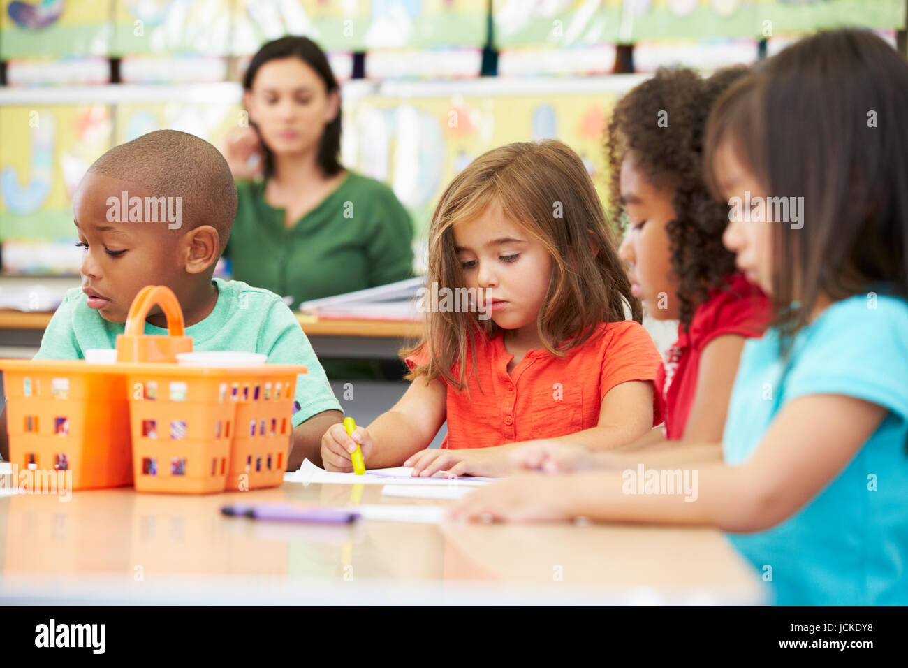 Group Of Elementary Age Children In Art Class With Teacher Stock Photo ...