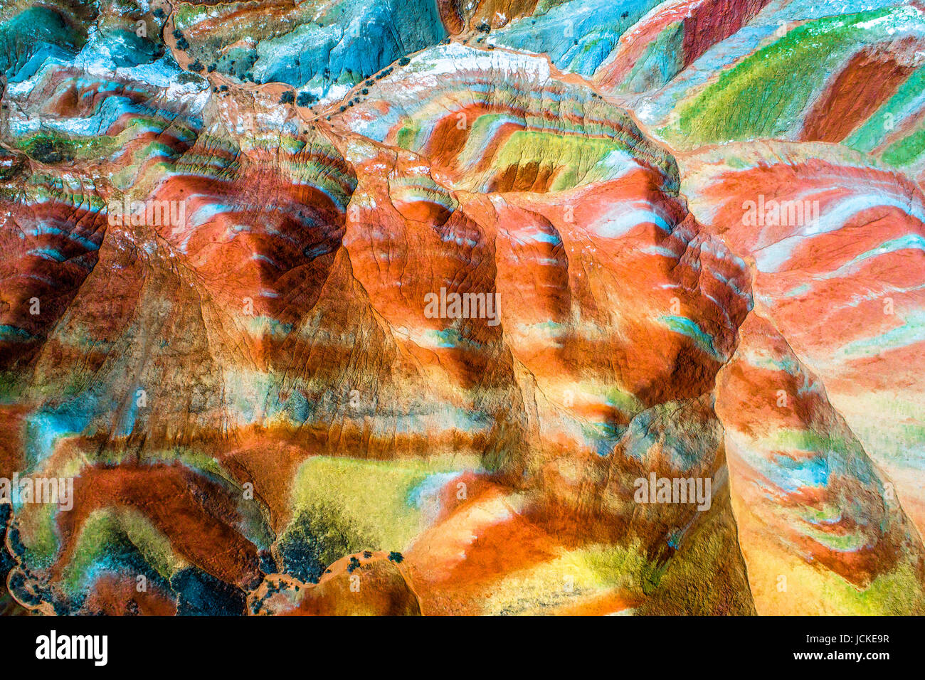 Aerial top down view on Zhangye Rainbow mountains displaying colorful pattern Stock Photo