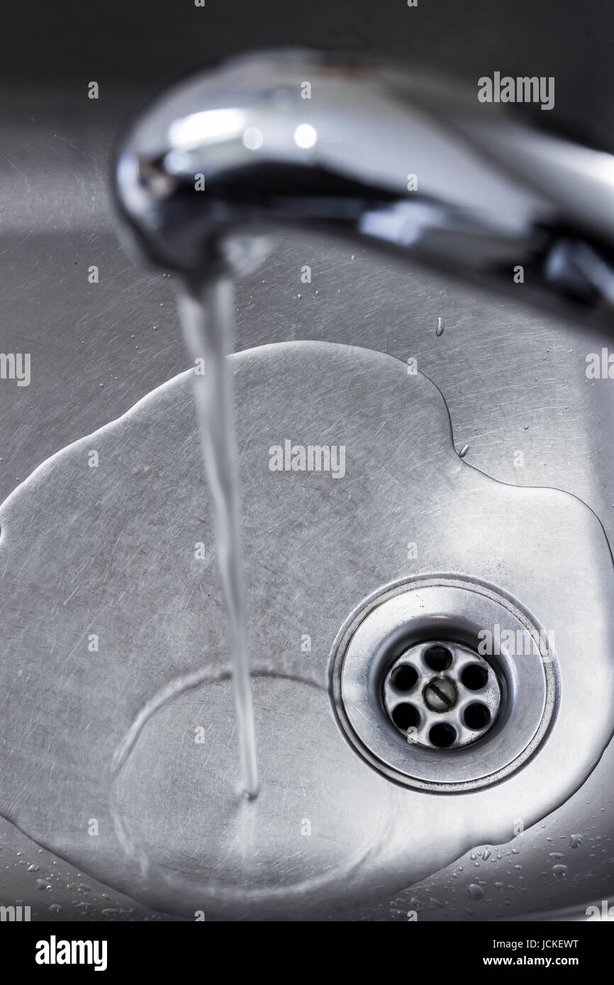 Drain hole in the kitchen sink closeup Stock Photo Alamy