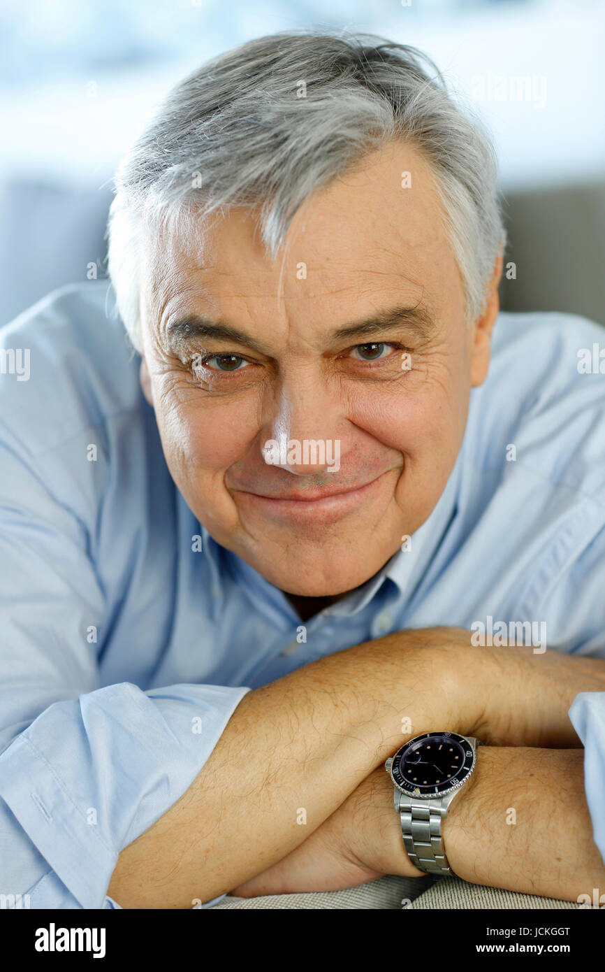 Portrait of senior man relaxing in sofa at home Stock Photo - Alamy
