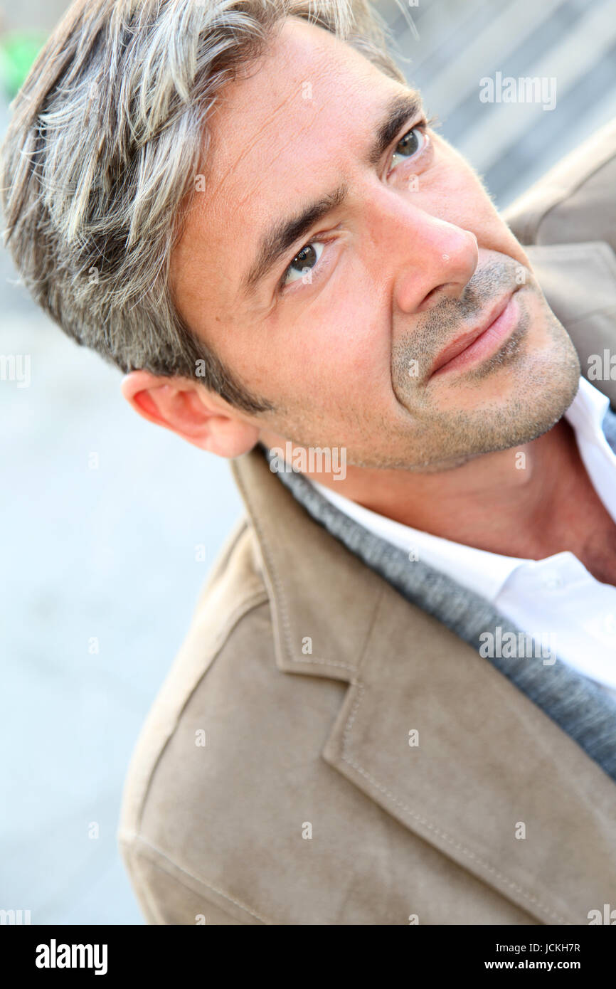 Portrait of handsome mature man in town Stock Photo