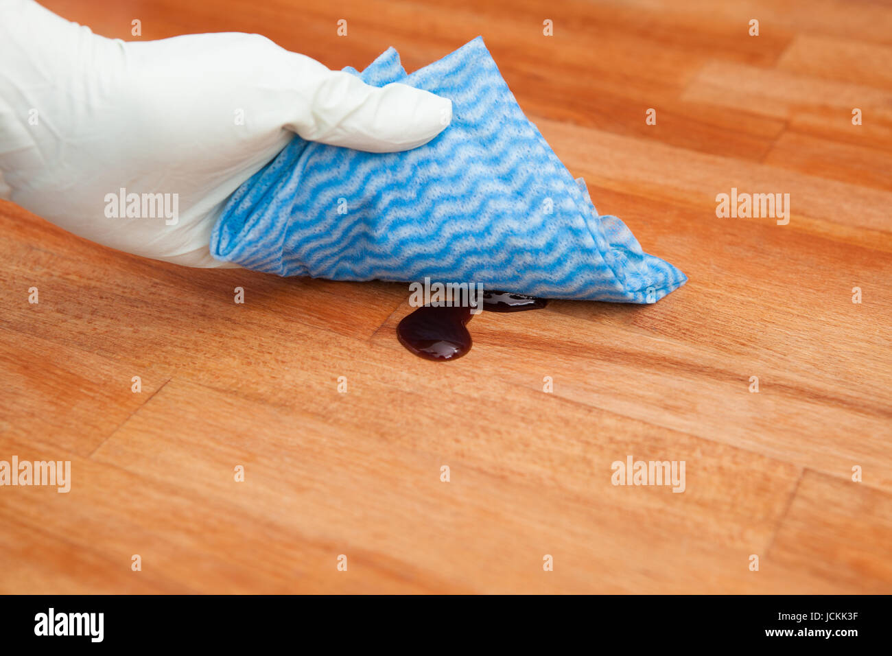 Person's Hand Cleaning Ketchup On Kitchen Countertop Stock Photo Alamy