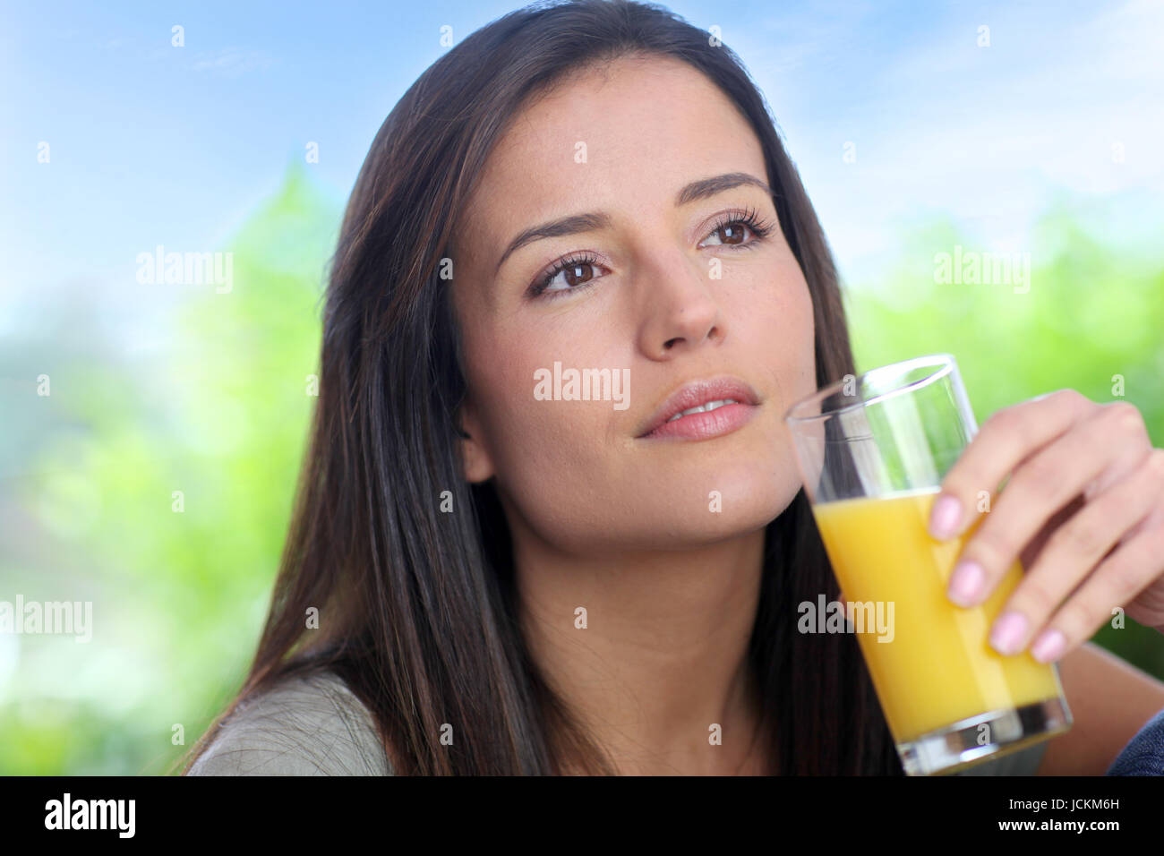 Young woman drinking fresh fruit juice Stock Photo Alamy
