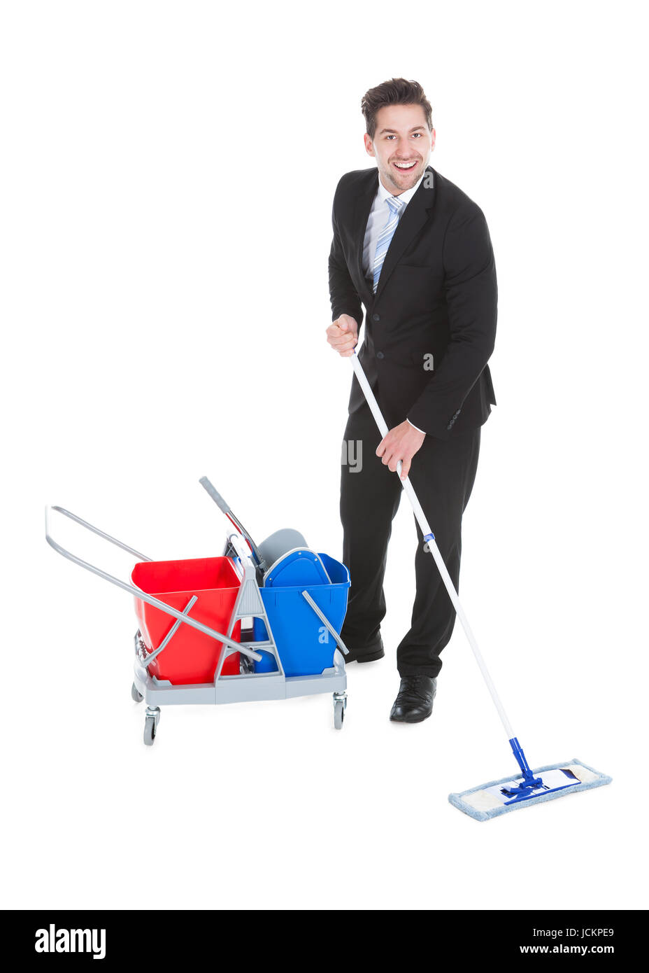 Full length of sad young businessman mopping over white background Stock Photo
