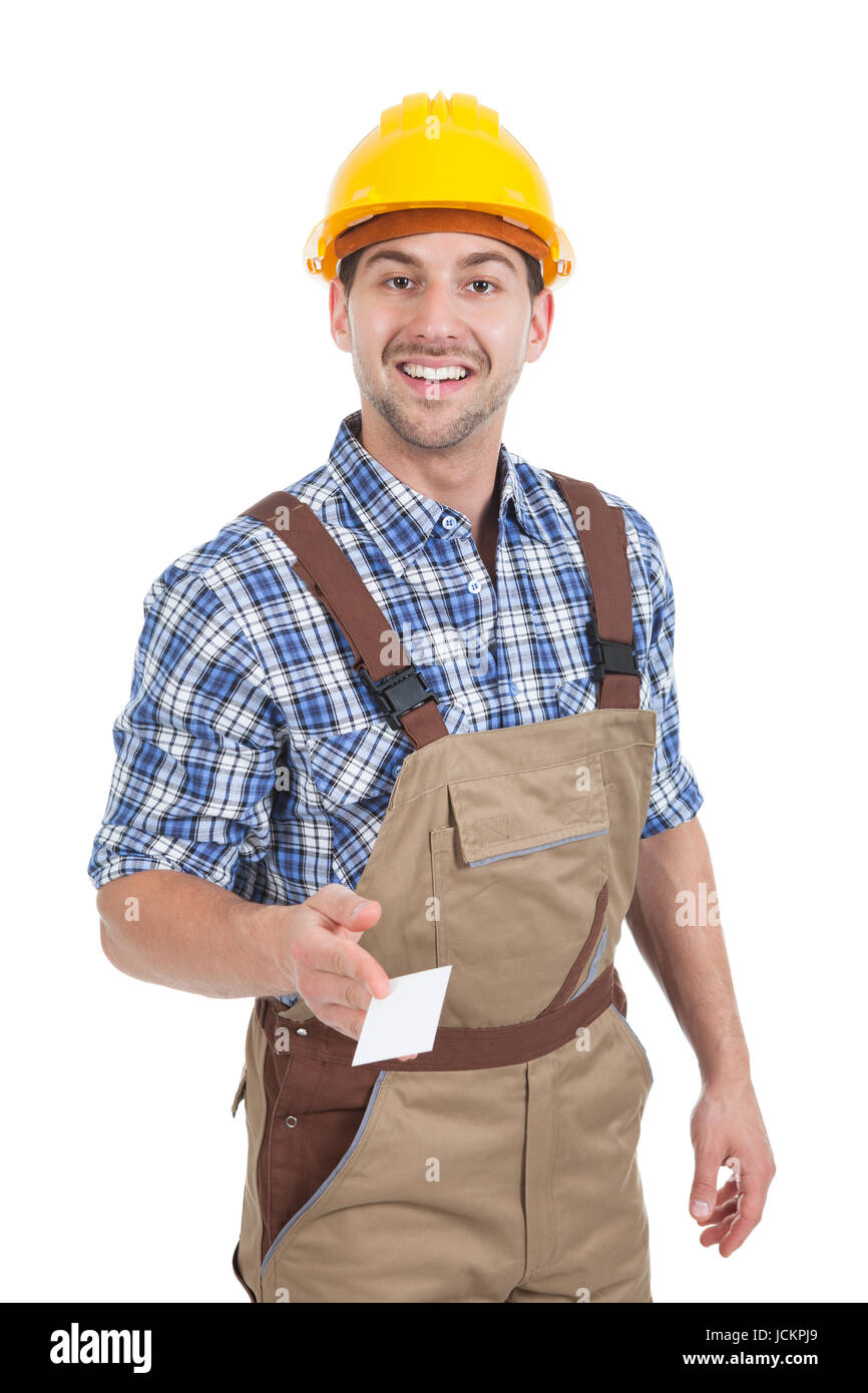 Shutterhand Worker Portrait of confident young manual worker giving visiting card over ...