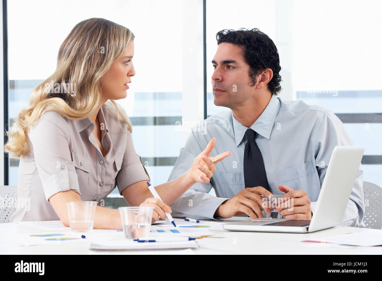 Businessman And Businesswoman Meeting In Office Stock Photo - Alamy