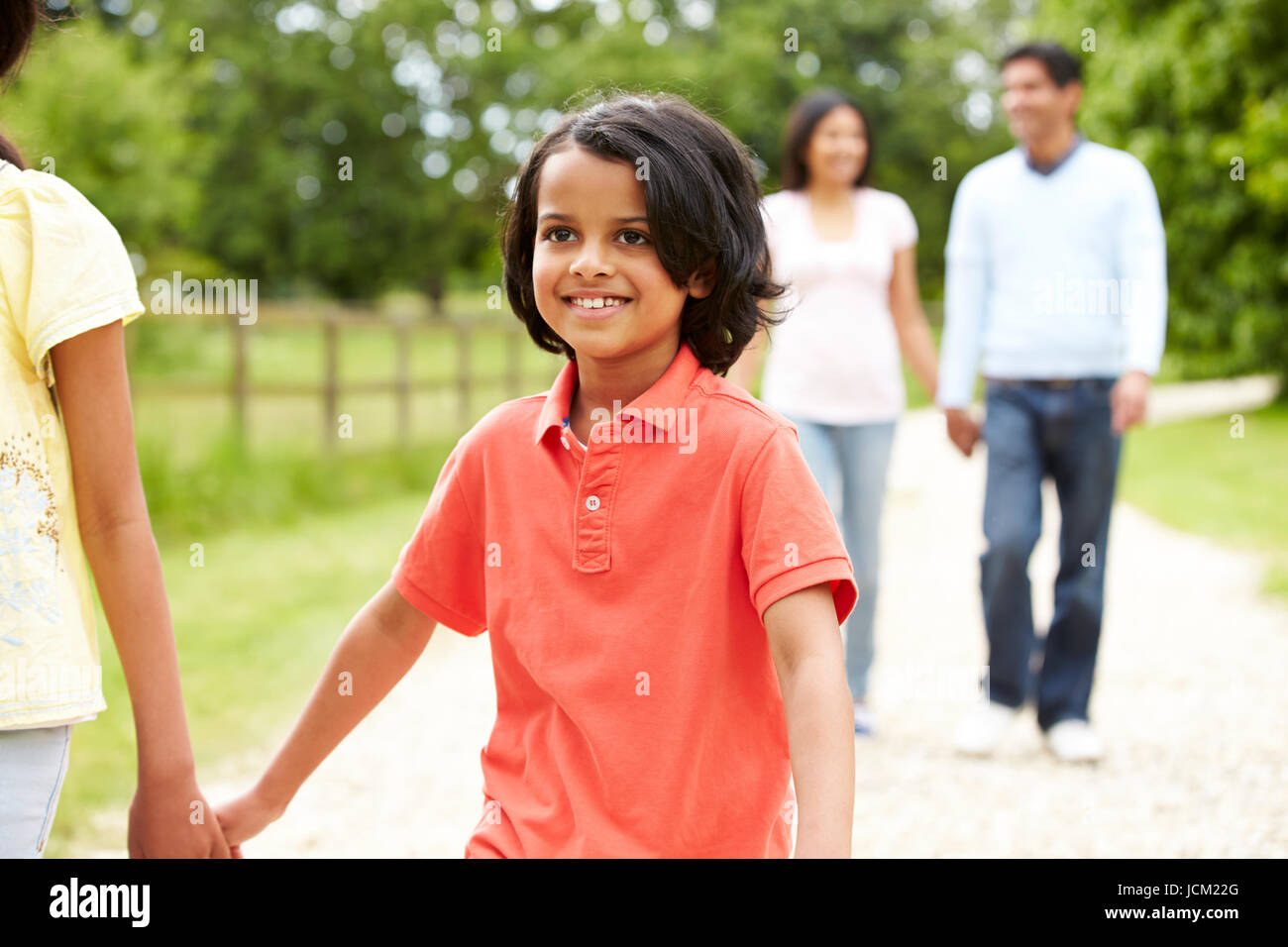 Indian Family Walking In Countryside Stock Photo - Alamy
