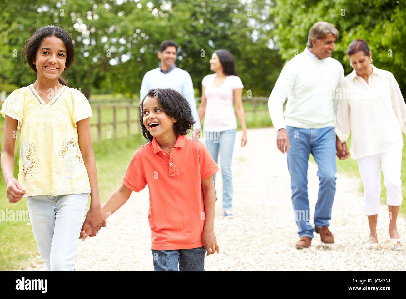 Muti-Generation Indian Family Walking In Countryside Stock Photo - Alamy