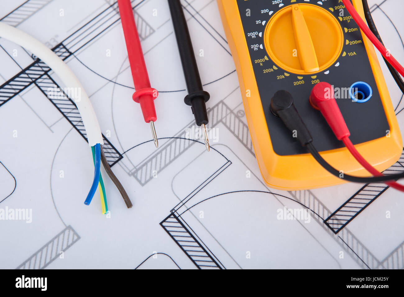 Closeup of multimeter with wires on blueprint Stock Photo Alamy