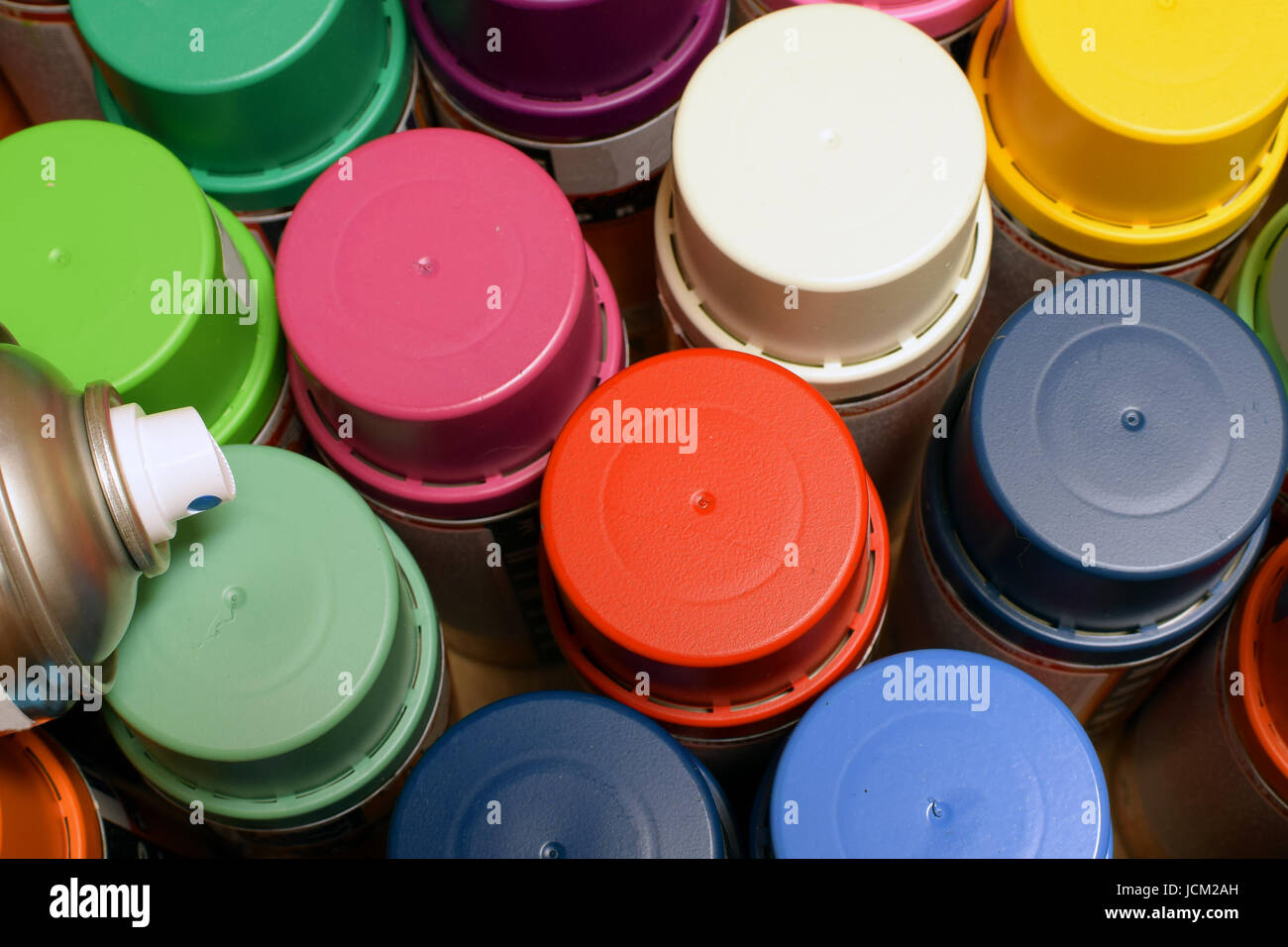 New spray paint cans. View from above. Stock Photo