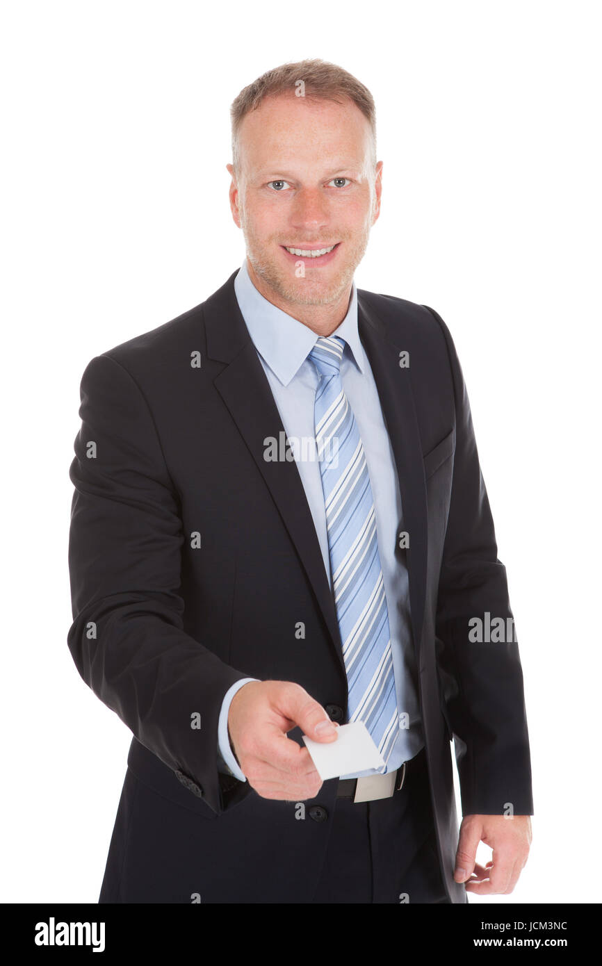 Full length portrait of happy businessman standing arms crossed ...