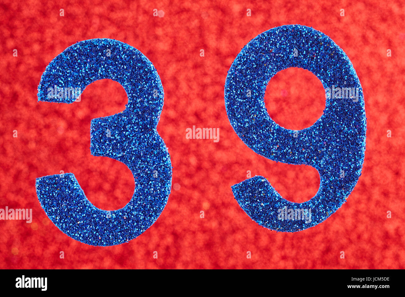 Number thirty-nine blue color over a red background. Anniversary. Horizontal Stock Photo