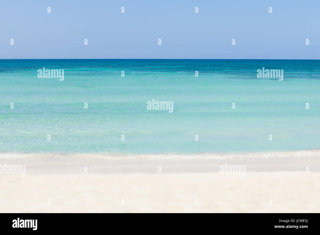 Sand Rushing Waves rushing on sand at tranquil beach Stock Photo - Alamy