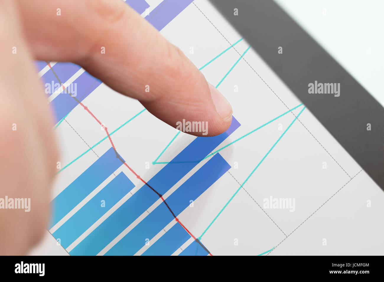 Cropped image of businessman analyzing graphs on digital tablet Stock ...