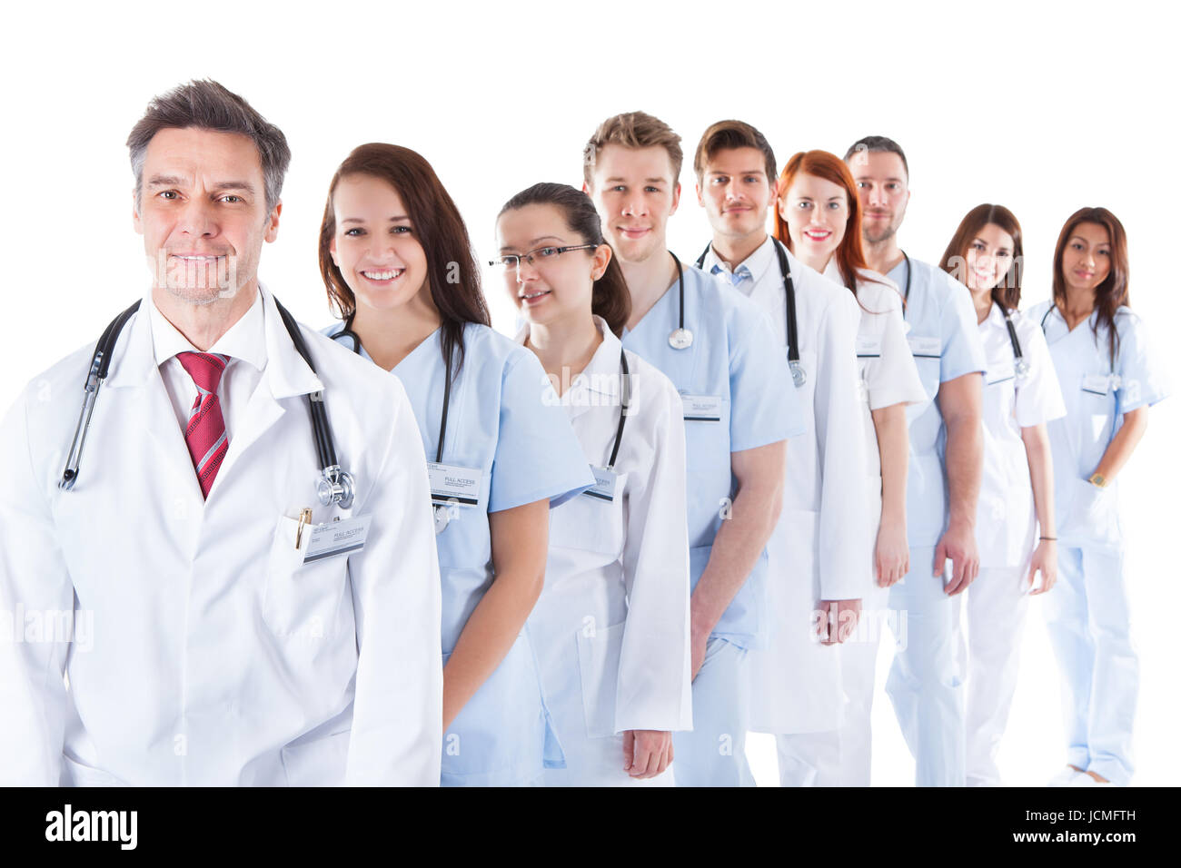 Long receding line or queue of smiling doctors and nurses in white